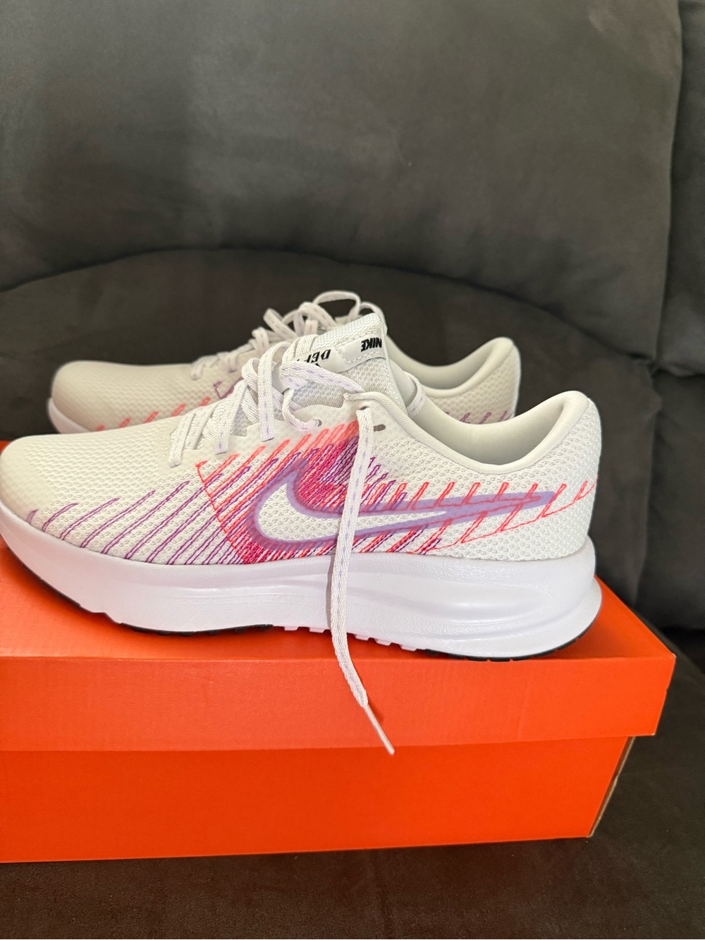 Nike White Running Shoes with Pink and Purple Stitching